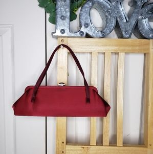 Burgundy satin evening handbag. Silver and crystal closure. 11" long 4" tall
